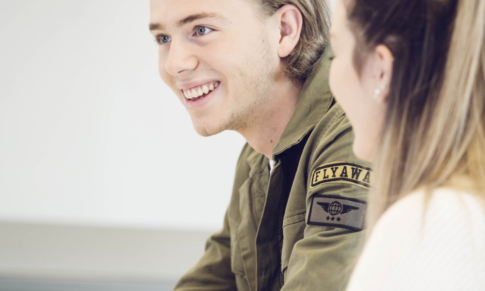 Elev smiler på kurs